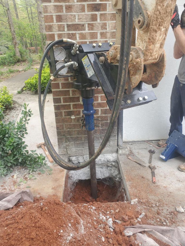 A WNC push pier install for a sinking column on a carport on a home in Western North Carolina of North Carolina.