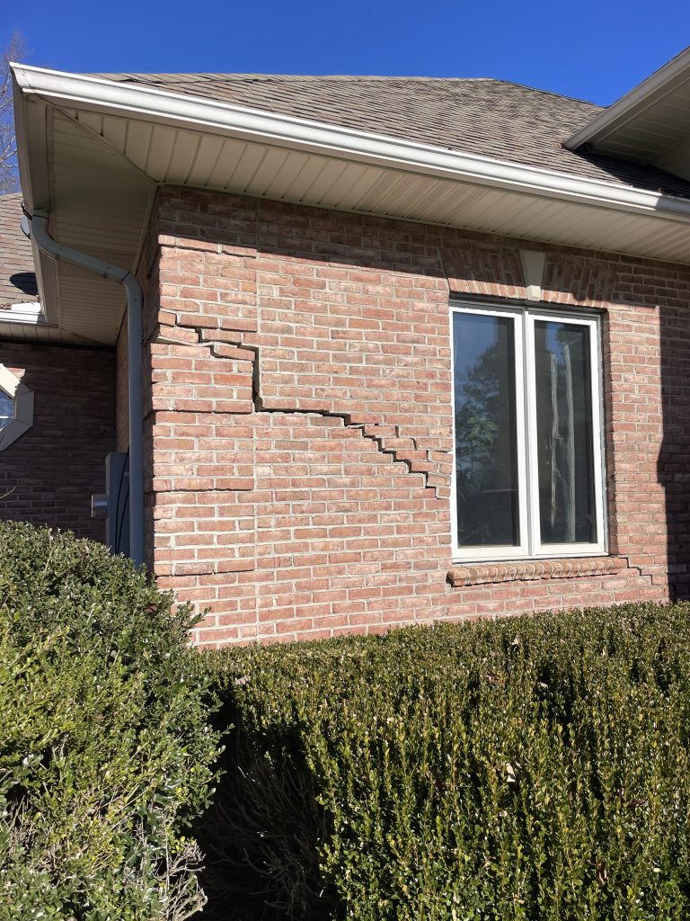 a large crack in a brick home in Sunset North Carolina due to poor compaction of the soil.