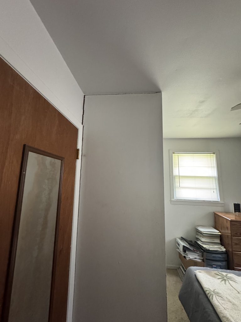 widening wall cracks showing movement in the flooring